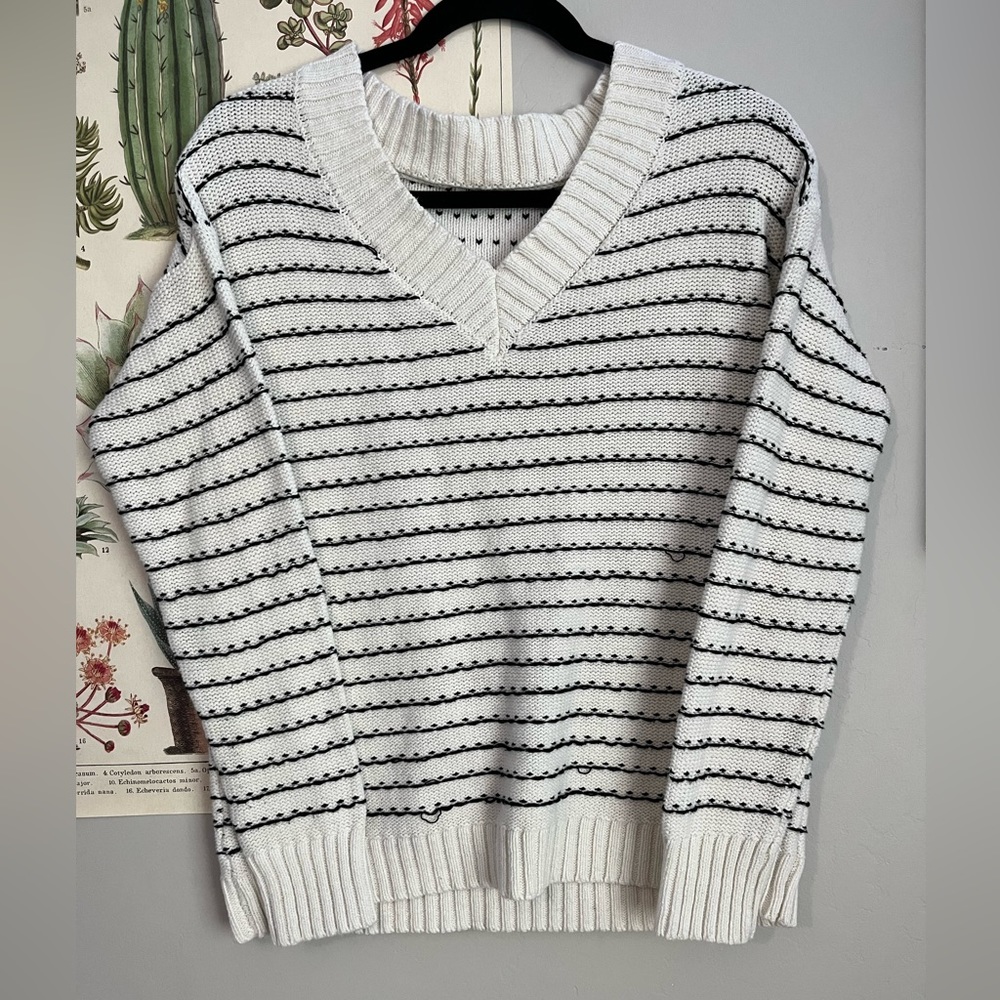 Black and white striped knitted sweater. Size M
